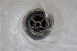 Shower drain with water flowing into it